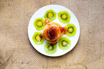 Pancakes with butter and fruit