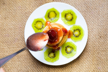 Pancakes with butter and fruit