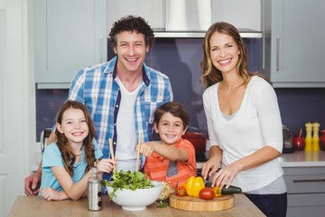 Portrait of happy family in kitchen