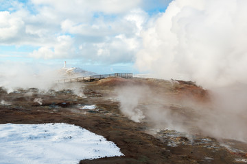 Active geothermal area Gunnuhver and lighthouse at winter, Reykjanes Peninsula, Iceland