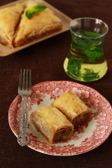 Baklava, turkish traditional delight with fresh mint and figs.