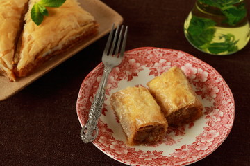Baklava, turkish traditional delight with fresh mint and figs.