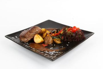 Image of tasty baked beef with potatos and vegetables