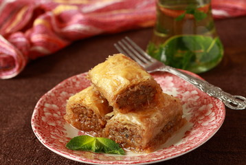 Baklava, turkish traditional delight with fresh mint and figs.