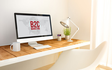 minimalist workplace with b2c concept computer