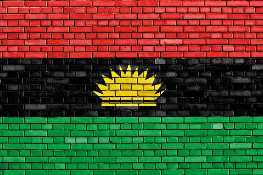 flag of Biafra painted on brick wall