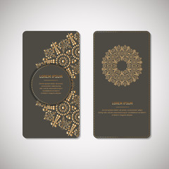 Set of two ornamental gold cards, flyers with flower oriental mandala on pale mustard color background. Ethnic vintage pattern. Indian, asian, arabic, islamic, ottoman motif. Vector illustration.