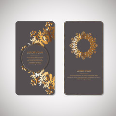 Set of two ornamental gold cards, flyers with flower oriental mandala on grey background. Ethnic vintage pattern. Indian, asian, arabic, islamic, ottoman motif. Vector illustration.