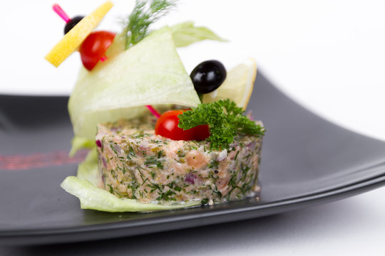 Image of tasty tartar with avokado and shrimps
