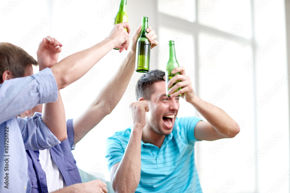 Poster happy male friends with beer watching tv at home