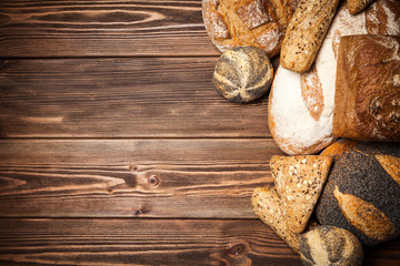 Fototapeta premium Bread assortment on wooden surface