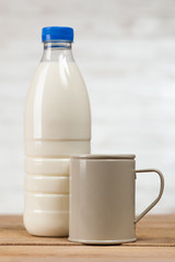 Milk bottle on wooden table