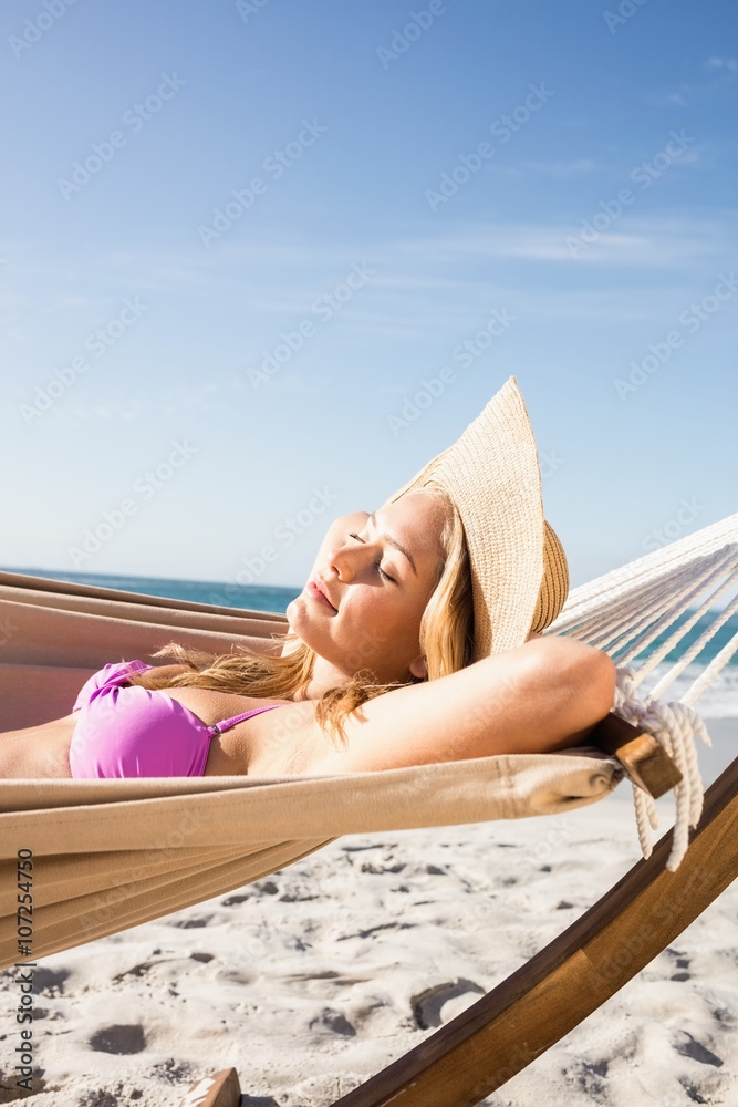 Poster woman lying in hammock