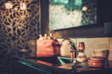 Shaving accessories in a luxury bathroom interior.