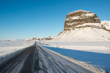 Winter landscape, icelandic main road and beautiful Lomagnupur mountain, Iceland