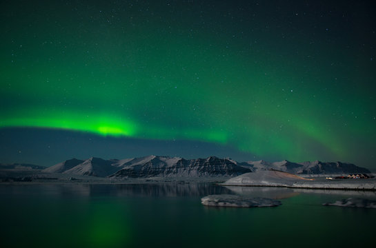 Aurora Borealis or Northern Lights over the glacier lagoon Jokulsarlon, Iceland