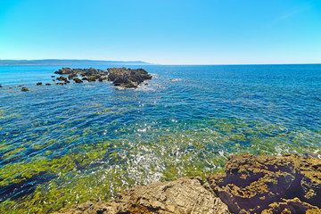 yellow rocks and blue sea in Sardinia