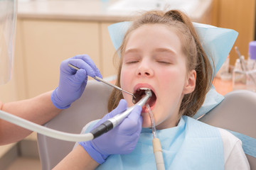 Young girl at dentist., dental treatment

