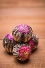 Chinese green tea balls with flowers, tea cup