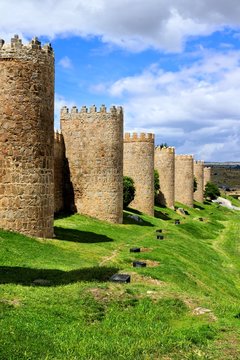 Mighty medieval wall and towers surrounding the old town of Avila, Spain