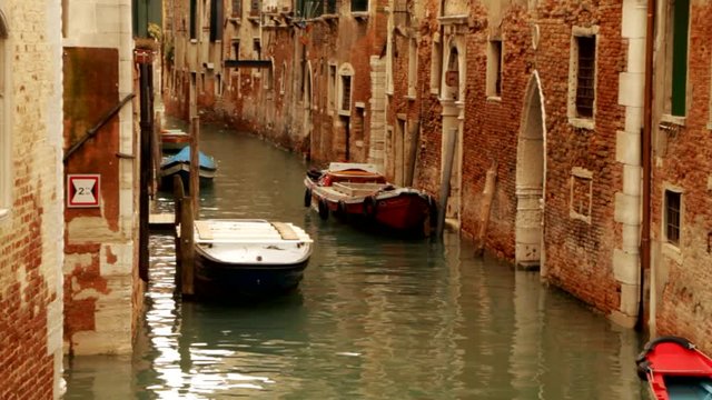 Gondola and boat on canal - Venice, Venezia