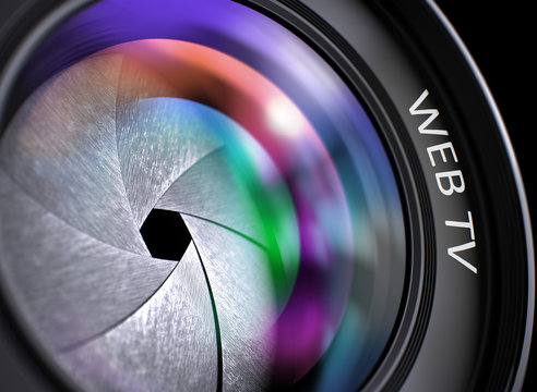 Lens of Digital Camera with Bright Colored Flares. Web Tv Concept. Web Tv - Text on Front of Camera Lens with Light of Reflection. Closeup View. 3D Render.