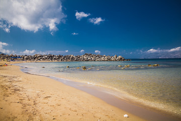 beach tropical with white sand and turquoise water under blue sky