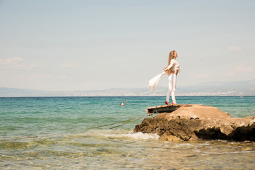 Beautiful young woman enjoying the ocean