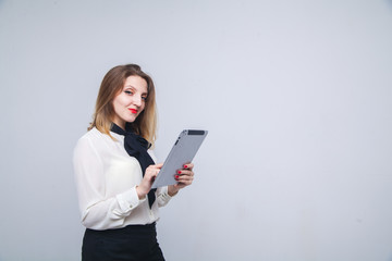 Fototapeta premium woman with a tablet pc isolated on white