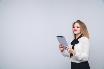 Fototapeta premium woman with a tablet pc isolated on white