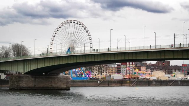 bridge over the river in Cologne, overlooking the amusement park
