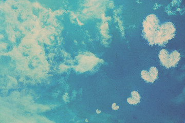 grunge heart clouds on the sky old paper background