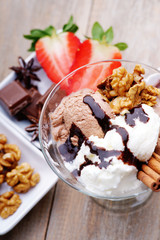 Ice cream sundae, chocolate and sliced strawberry