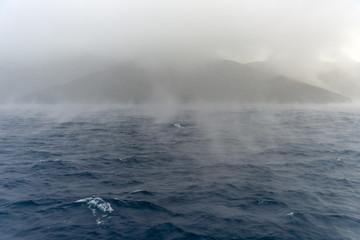 Obraz premium Wild sea during winter. Dramatic scenery with dark clouds and he