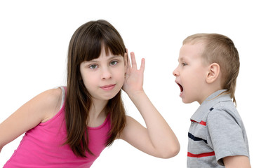 Girl listens to a boy on white background