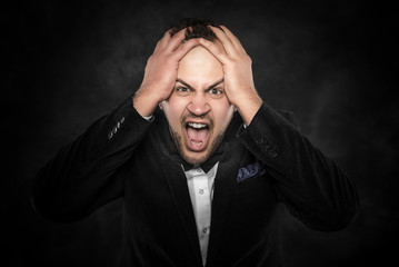 Angry businessman shouting.