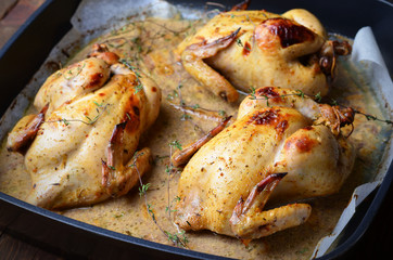Whole Roasted Chicken with sauce on baking tray