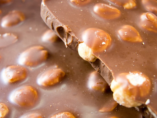 broken piece of delicious almond chocolate 