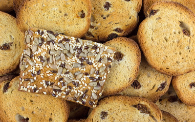ruddy cookie with sesame seeds on a background of home biscuits