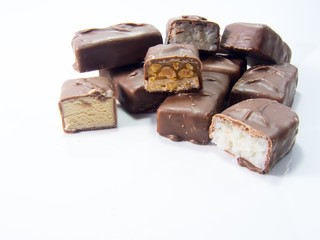 assorted chocolate bars on white background 