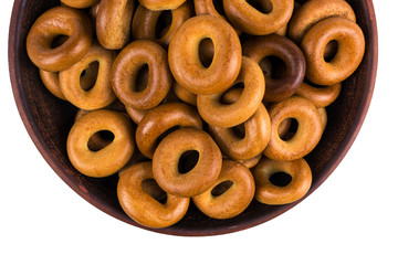 homemade bagels on a clay plate isolated on white background. to