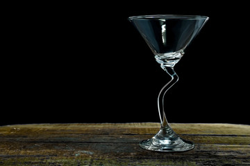 glass with clipping path included on table and dark background