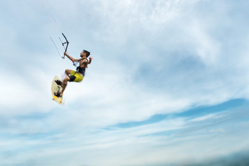 Naklejka na ściany i meble Surfer flying through the sky