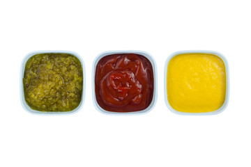 ketchup, mustard, pickles on bowl