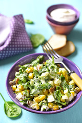 Spinach salad with sweet corn,boiled egg and fried bacon.