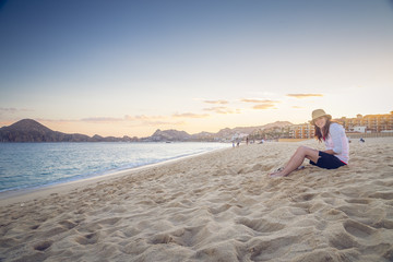 Woman Enjoys time on the beach in Mexico