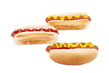 three hot dog sandwiches