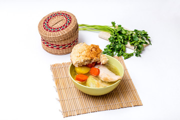 Soup bowl with accessories on a white background - pita bread, p