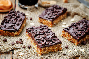 raw vegan dates oats peanut butter bars with chocolate frosting
