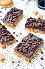 raw vegan dates oats peanut butter bars with chocolate frosting
